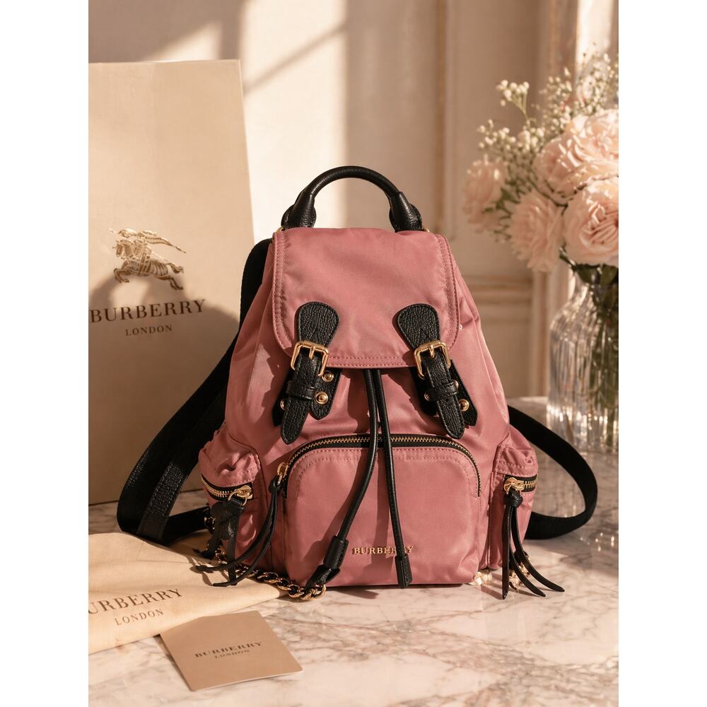 Burberry "The Rucksack" in pink nylon with black leather trim.
